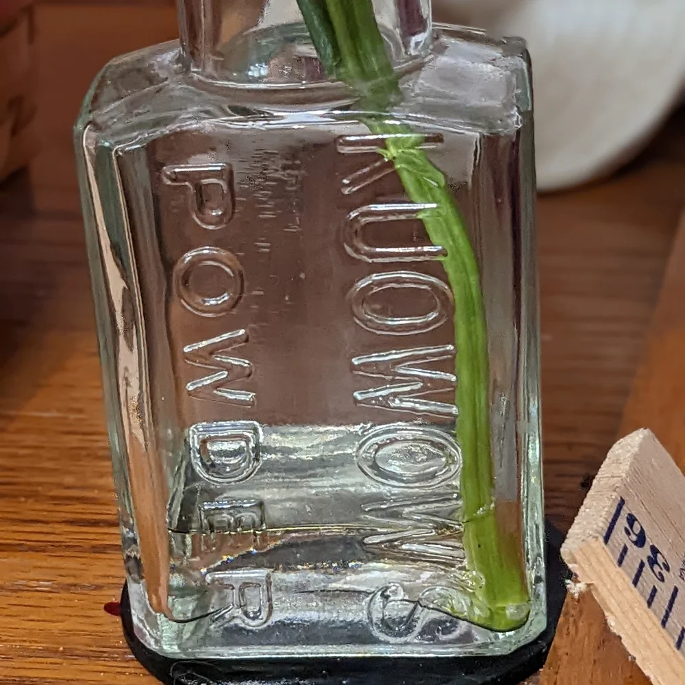 Beautiful faux flower in vintage container